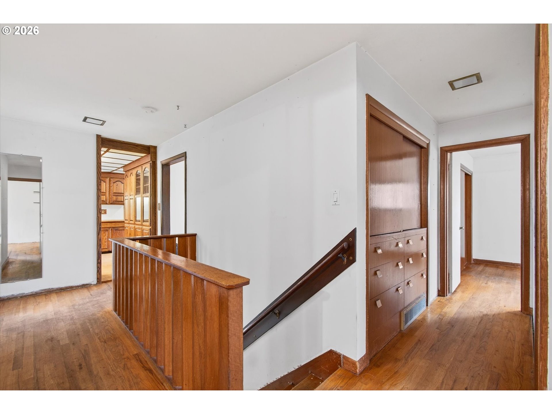 919 Cascade Drive Longview, WA 98632 - Photo 18 of 33 a hallway with wooden floor and chandelier