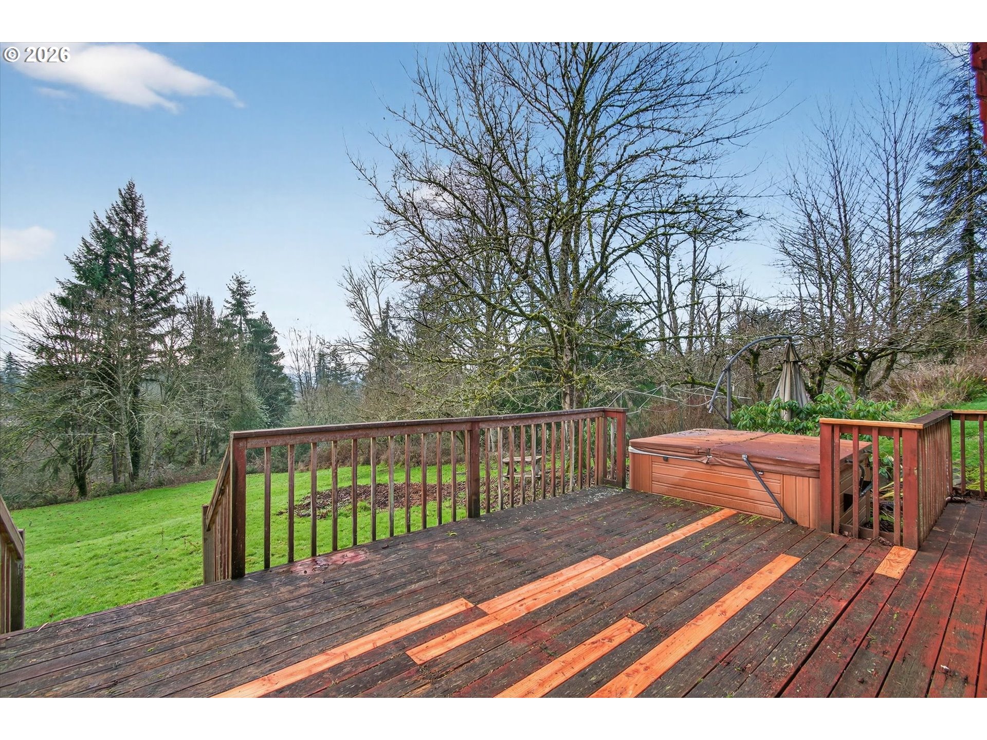 919 Cascade Drive Longview, WA 98632 - Photo 27 of 33 a view of a wooden deck with a bench