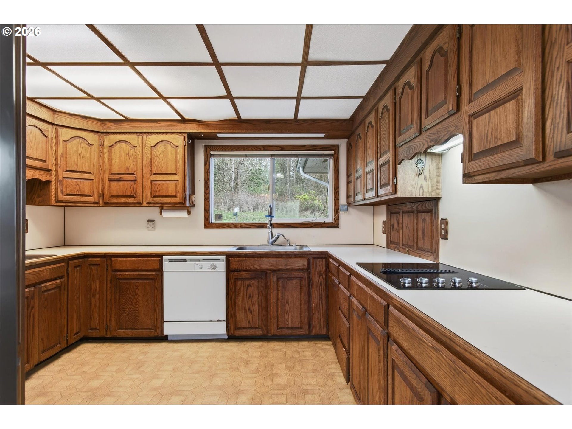 919 Cascade Drive Longview, WA 98632 - Photo 8 of 33 a kitchen with stainless steel appliances granite countertop a stove a sink dishwasher and cabinets with wooden floor
