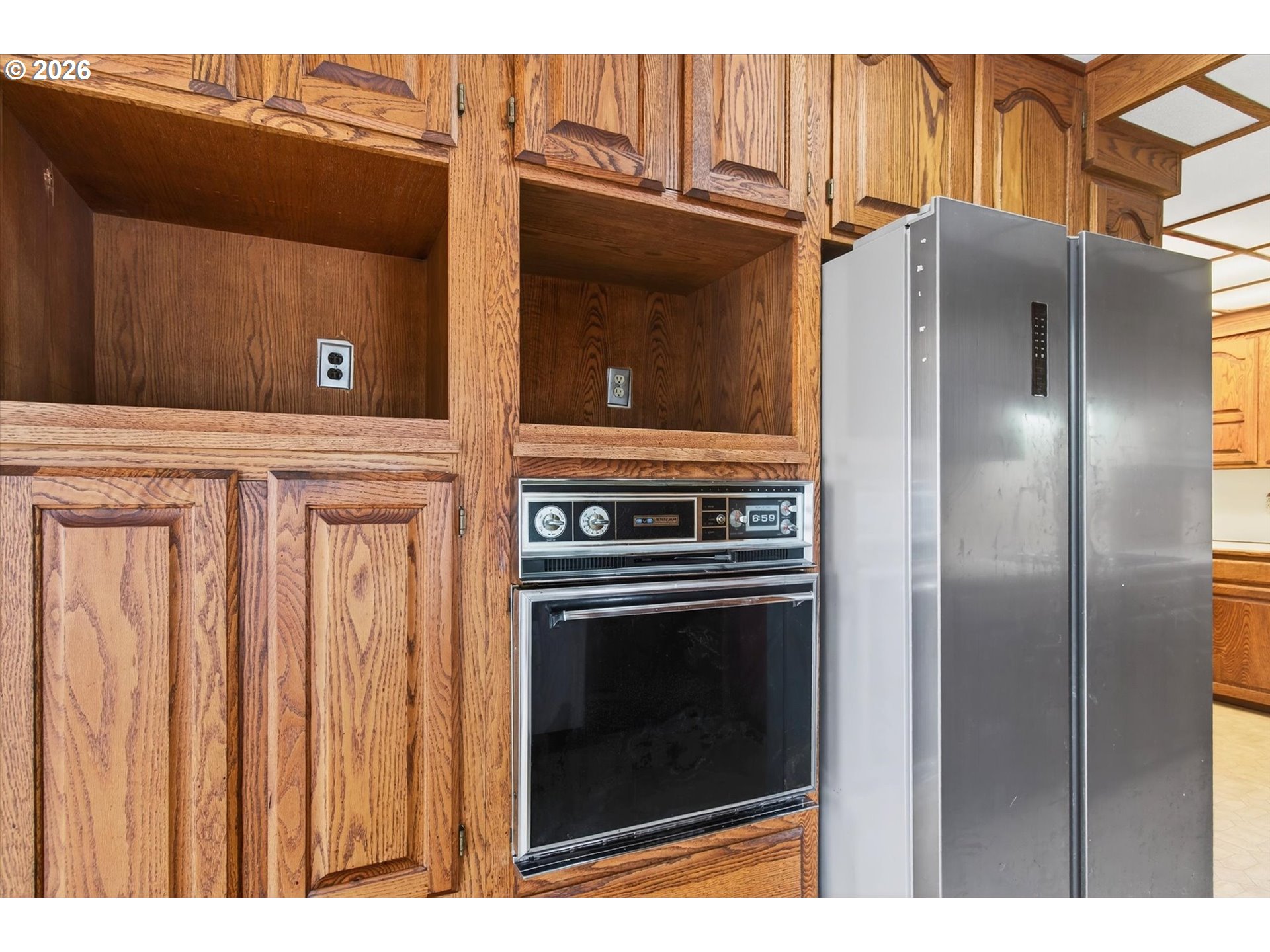 919 Cascade Drive Longview, WA 98632 - Photo 9 of 33 a kitchen with stainless steel appliances granite countertop a refrigerator and a stove
