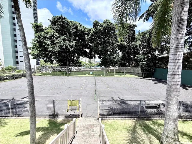 a view of a chair and tables in the garden
