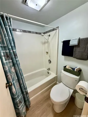 a bedroom with a large bed and a large window