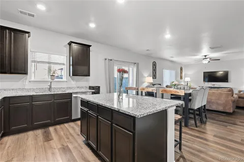 a kitchen with sink cabinets and stainless steel appliances