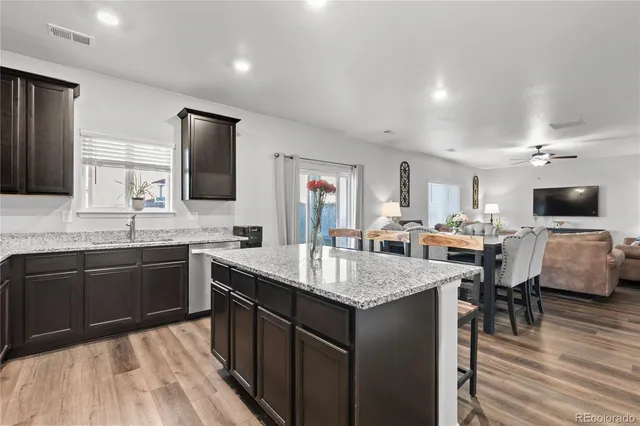 a kitchen with sink cabinets and stainless steel appliances