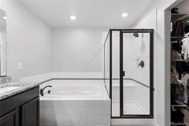 a bathroom with a bathtub and a shower