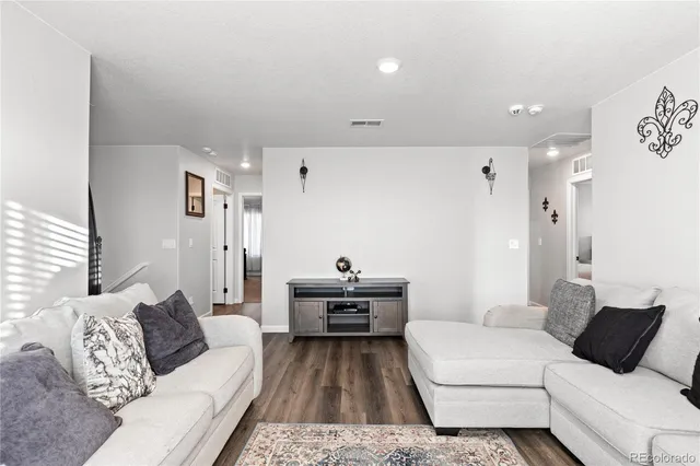 a living room with furniture and a couch