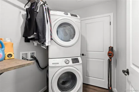 a close view of a utility room with dryer and washer