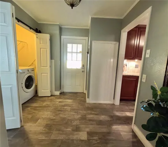 a view of an entryway with a door