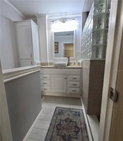 a spacious bathroom with a granite countertop sink a mirror and a