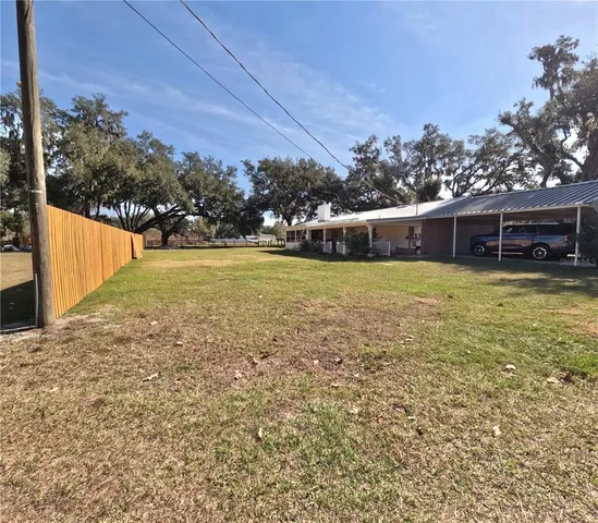 a view of a swimming pool with an outdoor seating
