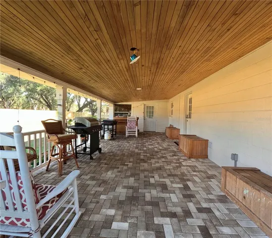 a view of a porch with furniture