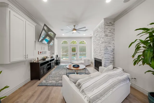 a living room with furniture fireplace and flat screen tv