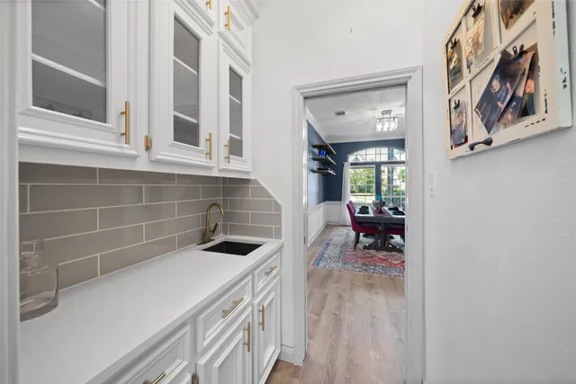a kitchen with a sink and cabinets
