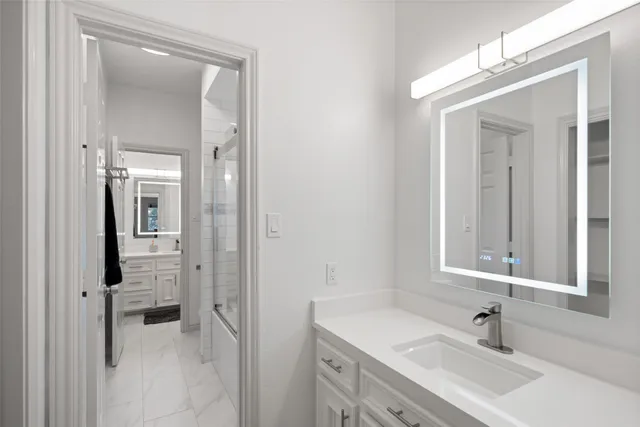 a bathroom with a sink and a mirror
