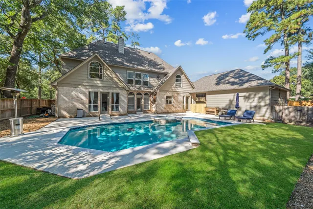a front view of a house with a yard table and chairs