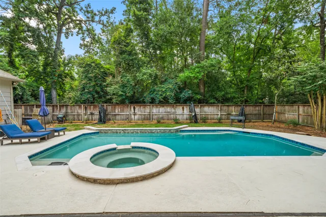 a view of swimming pool with seating space