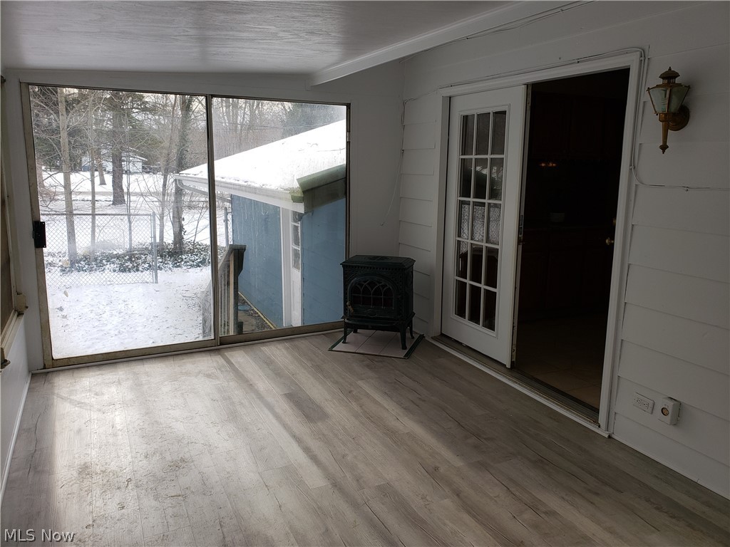 11415 Ferry Road Chesterland, OH 44026 - Photo 15 of 31 enclosed rear porch with sliders to the fenced-in back yard