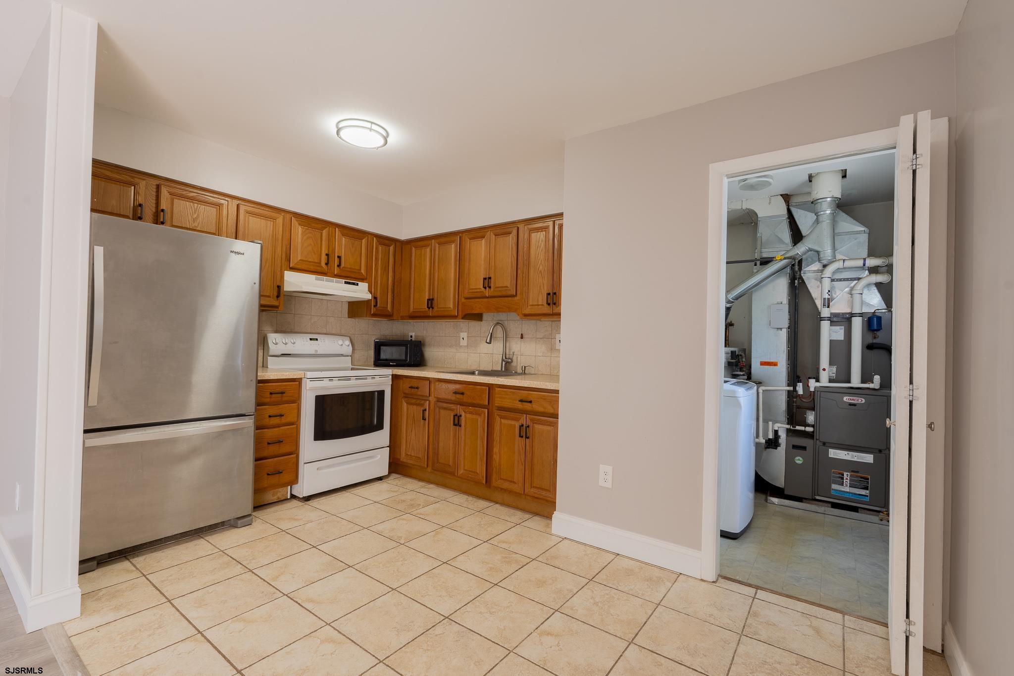 1137 South Beecham Road Williamstown, NJ 08094 - Photo 14 of 47 a kitchen with stainless steel appliances granite countertop a refrigerator and a stove top oven