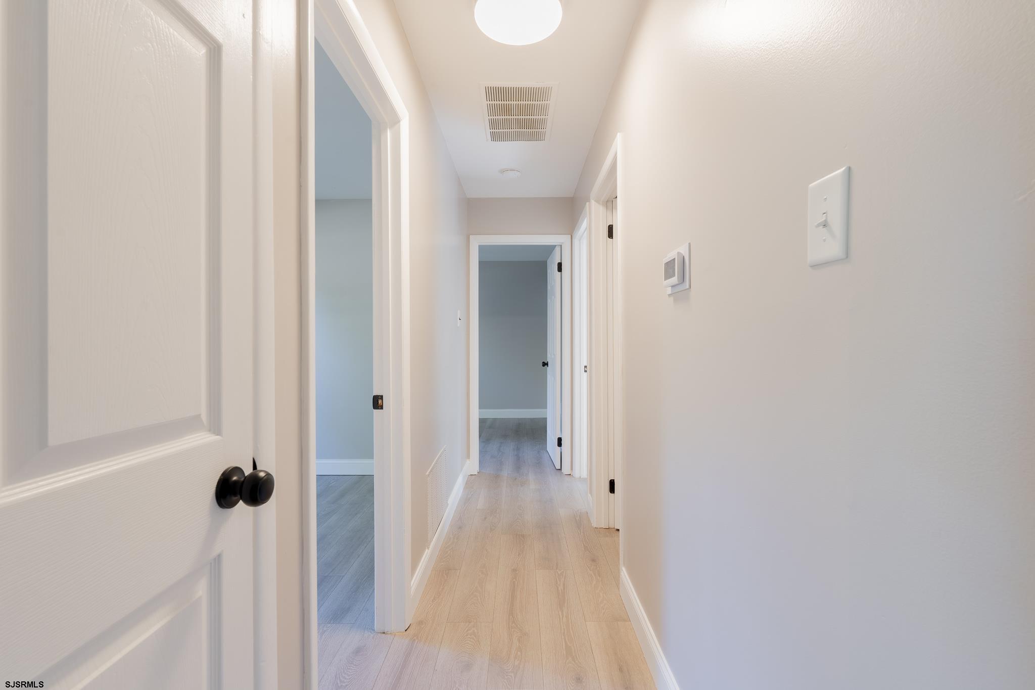 1137 South Beecham Road Williamstown, NJ 08094 - Photo 20 of 47 a view of a hallway with wooden floor