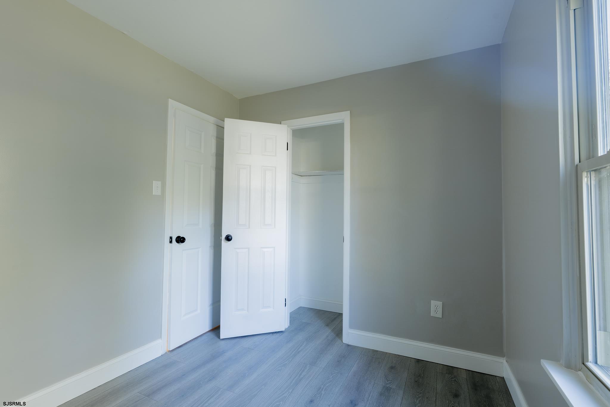 1137 South Beecham Road Williamstown, NJ 08094 - Photo 23 of 47 a view of an empty room with wooden floor