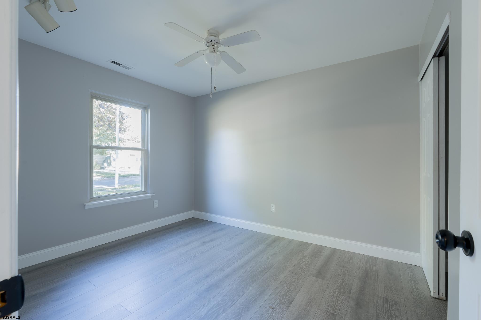 1137 South Beecham Road Williamstown, NJ 08094 - Photo 25 of 47 wooden floor in an empty room with a window