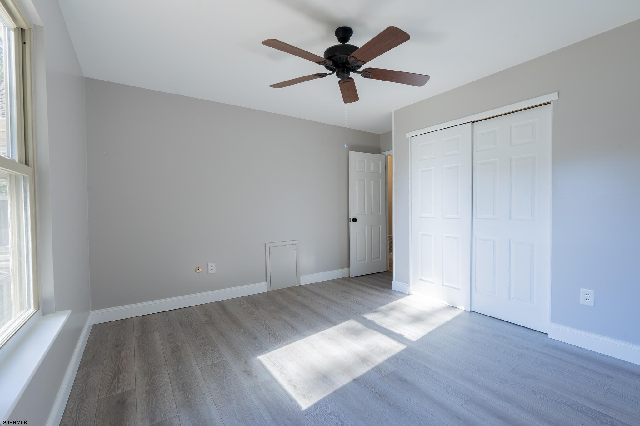 1137 South Beecham Road Williamstown, NJ 08094 - Photo 30 of 47 a view of empty room with wooden floor and fan