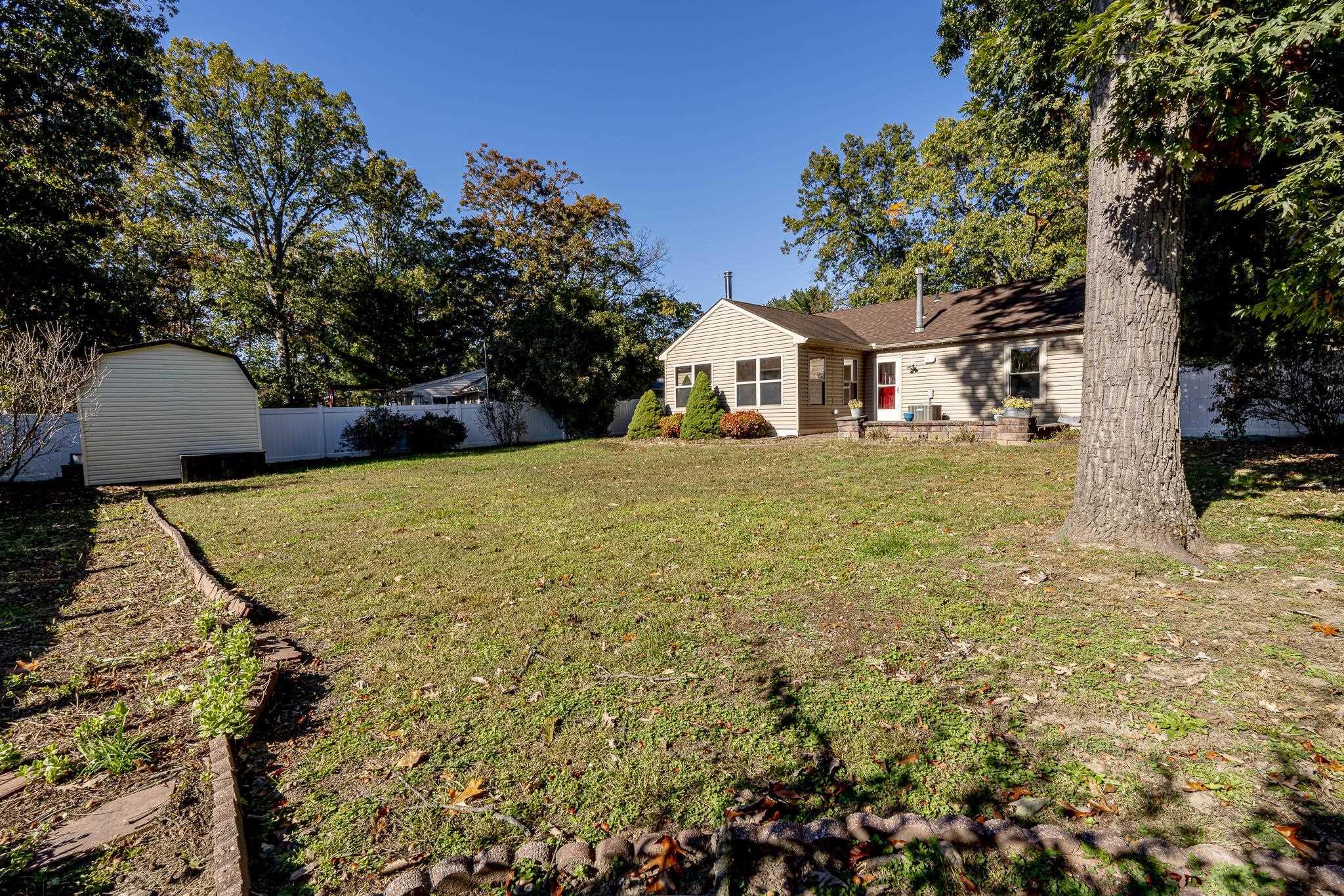 1137 South Beecham Road Williamstown, NJ 08094 - Photo 35 of 47 a view of a large house with a yard and large tree