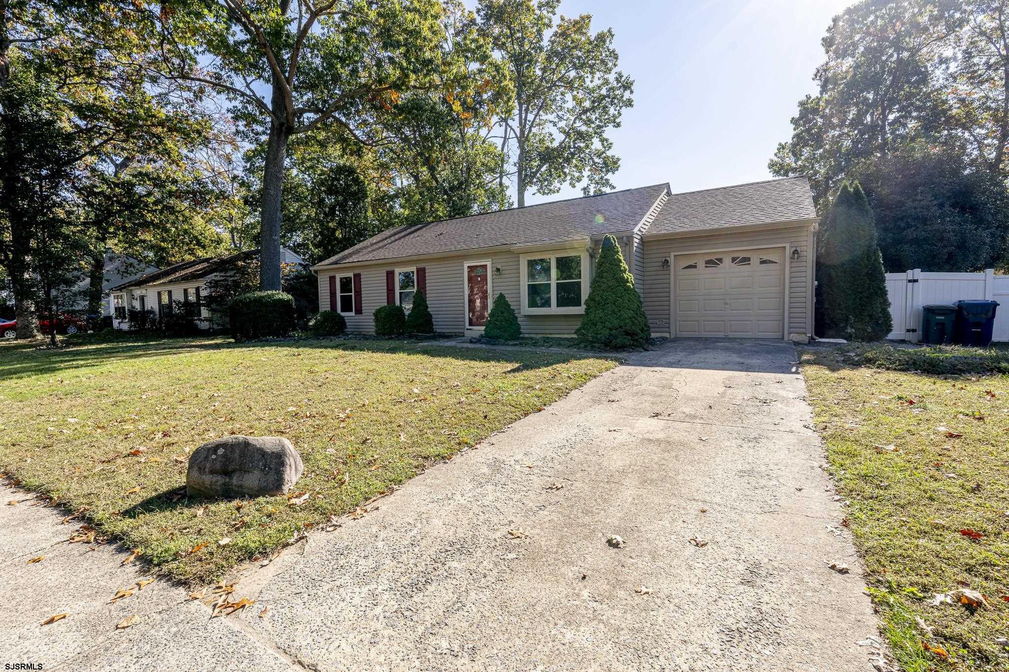 1137 South Beecham Road Williamstown, NJ 08094 - Photo 41 of 47 a front view of a house with a yard and trees