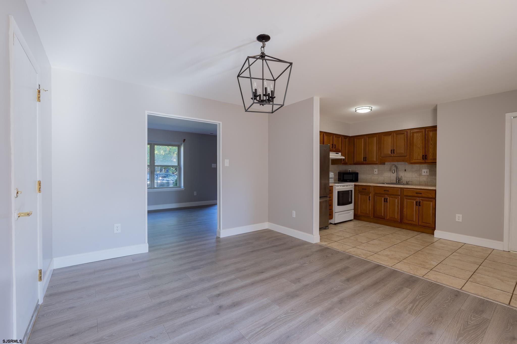 1137 South Beecham Road Williamstown, NJ 08094 - Photo 9 of 47 a view of a kitchen with a sink cabinets and wooden floor