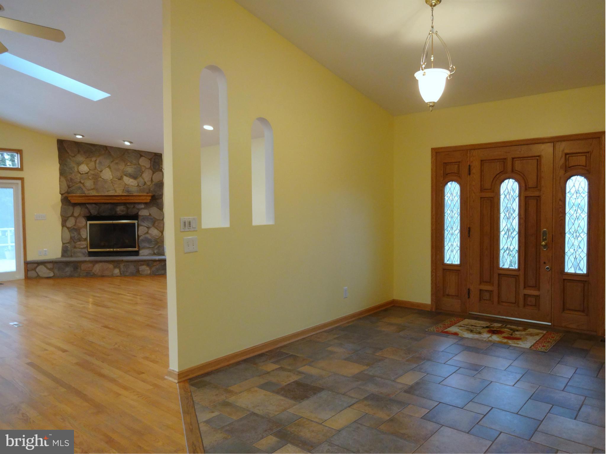 8096 Ventnor Road Pasadena, MD 21122 - Photo 30 of 30 Foyer leads to Open Floor Plan w/ Vaulted Ceilings