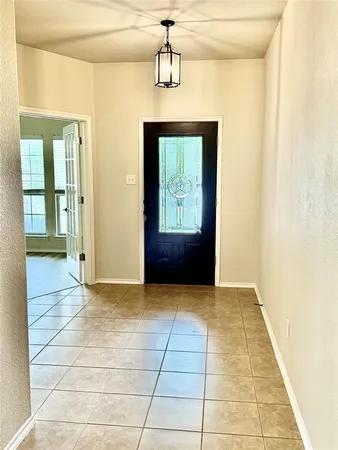 a view of hallway with a front door