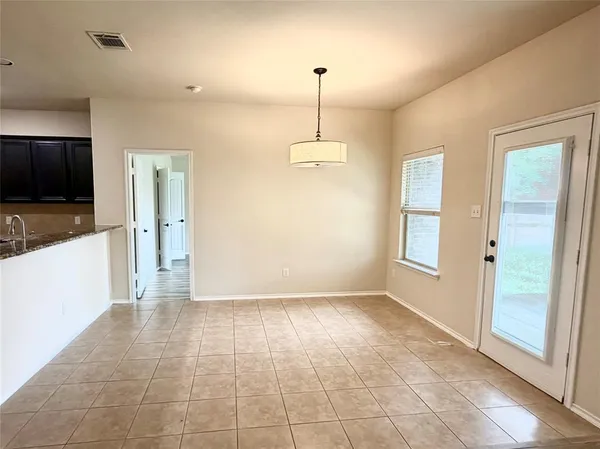 a view of a kitchen with a sink and a window