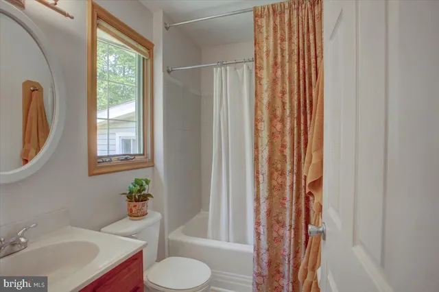 a bedroom with a bed and a chair