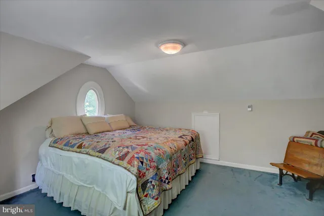 a kitchen with stainless steel appliances granite countertop a sink a stove a refrigerator dining table and chairs