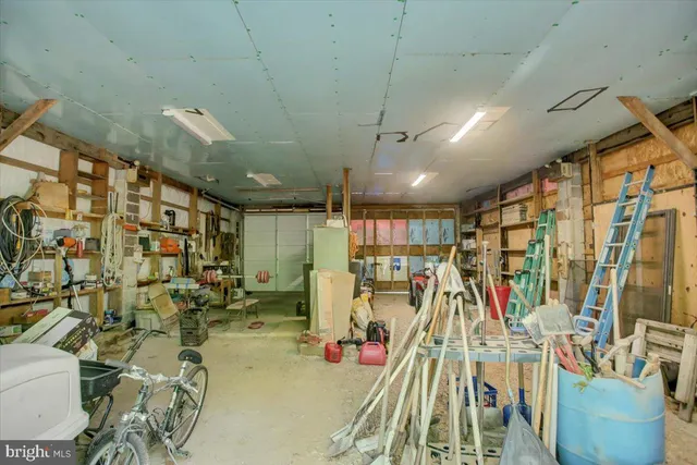 a view of a backyard with wooden fence