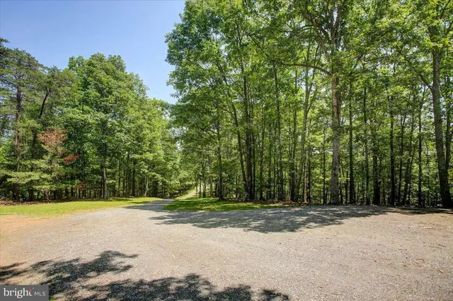 a view of a backyard with sitting area