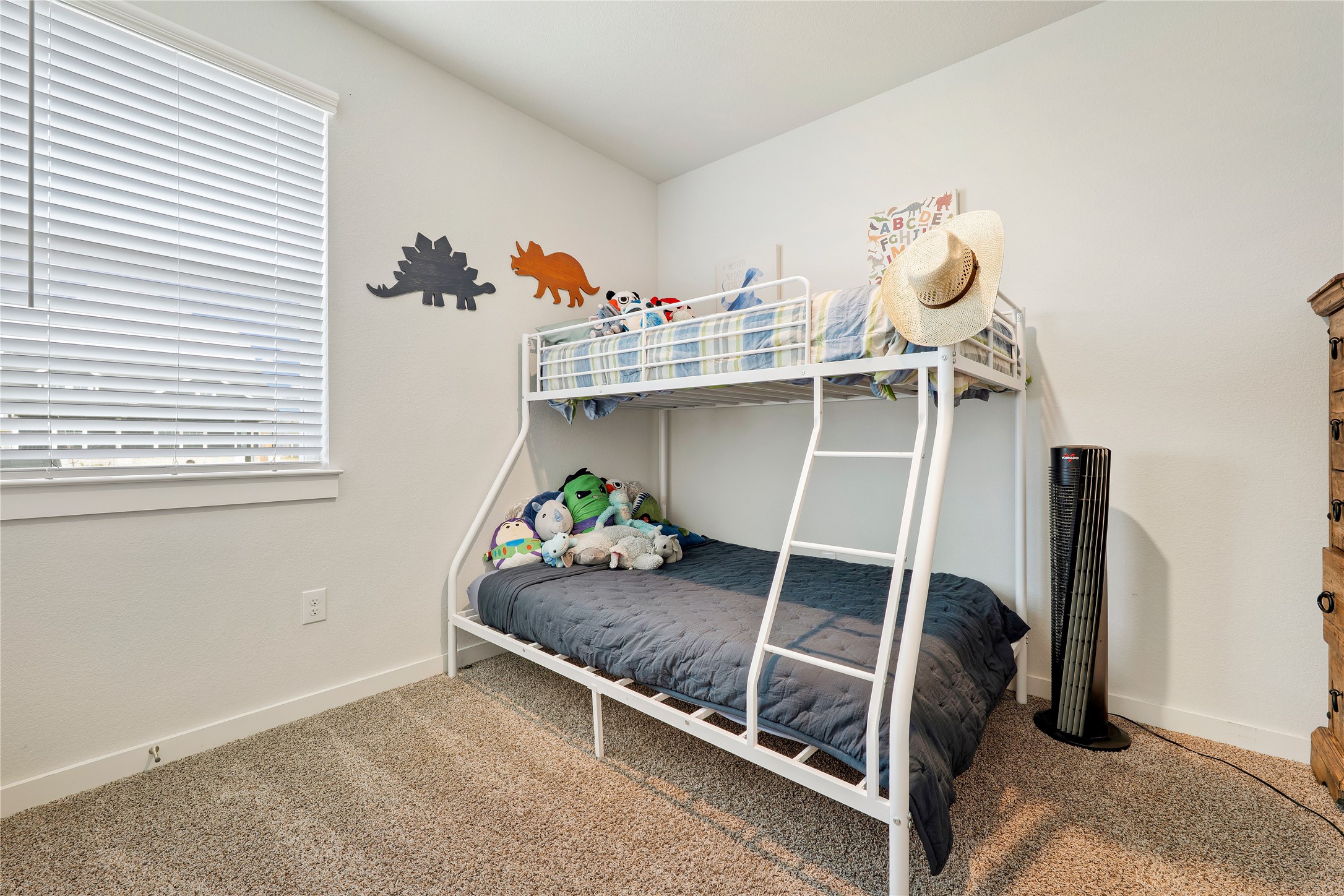 171 Acadia Drive Kyle, TX 78640 - Photo 16 of 26 Bedroom #2 featuring colored carpet and baseboards