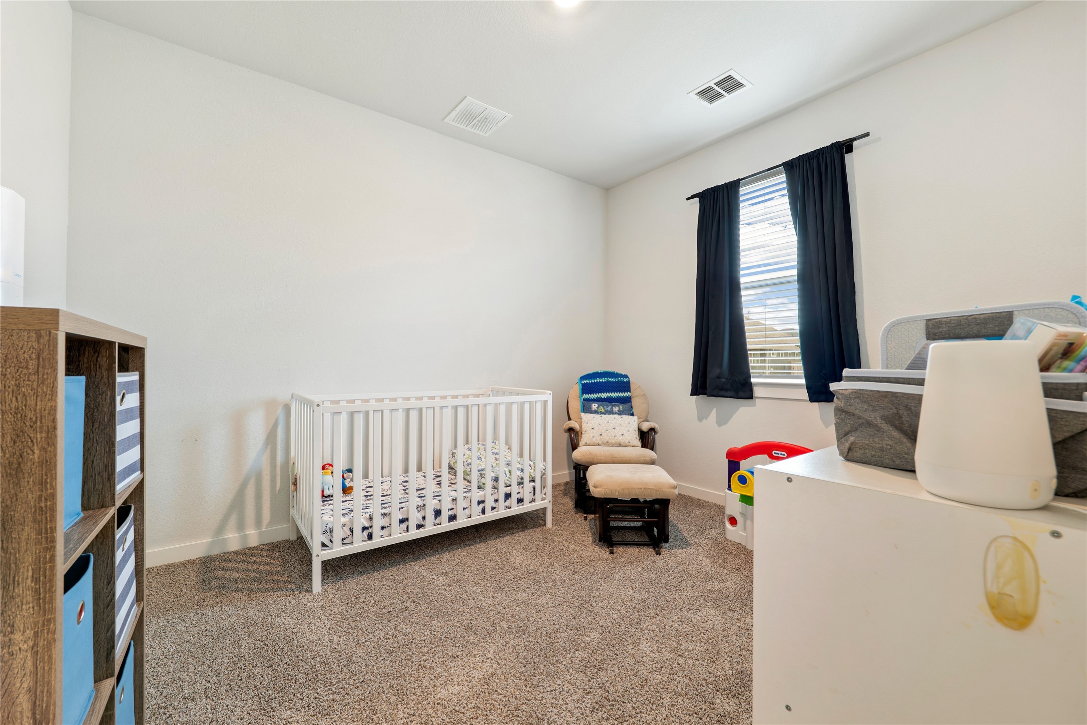 171 Acadia Drive Kyle, TX 78640 - Photo 17 of 26 Bedroom #3 featuring colored carpet and baseboards