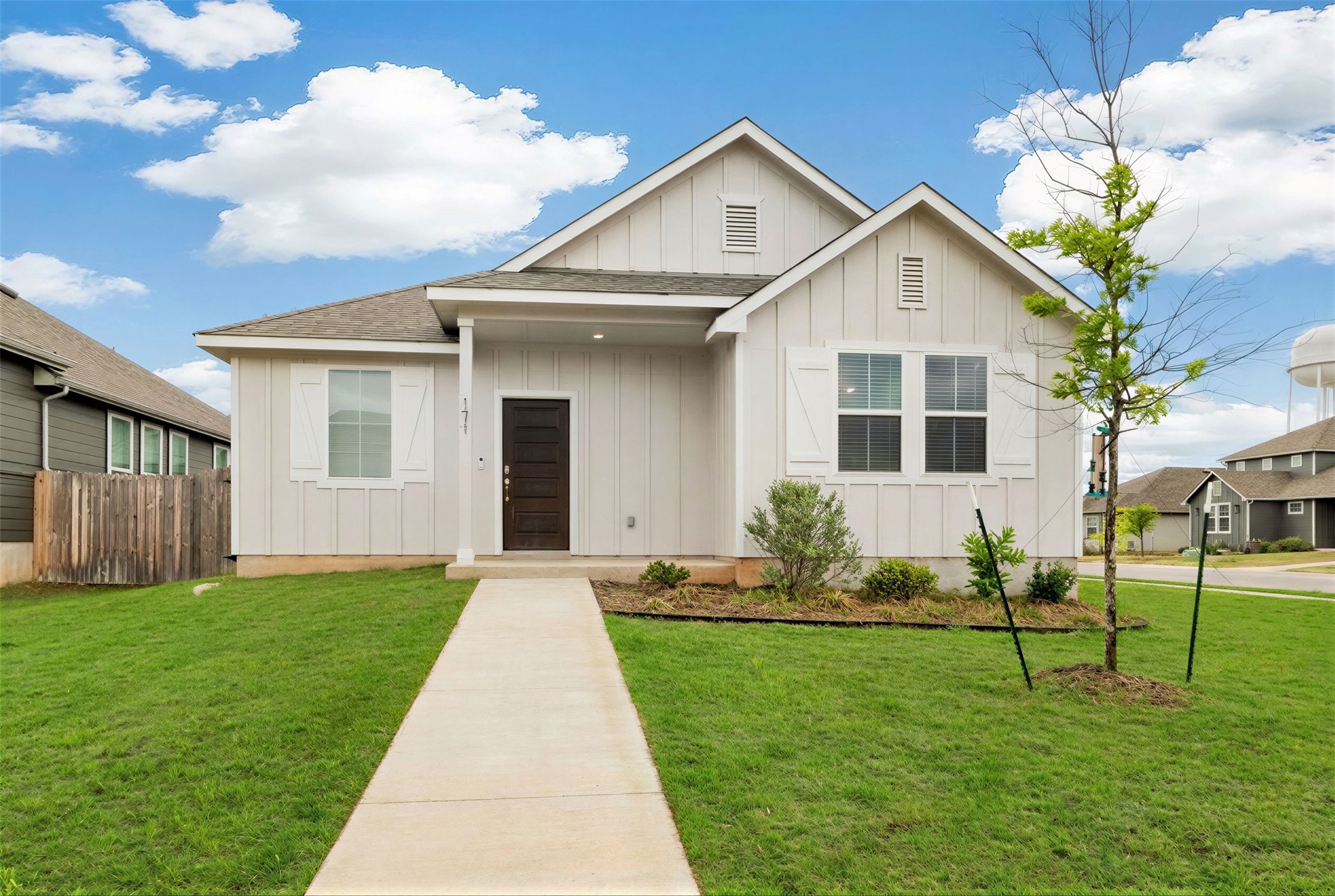 171 Acadia Drive Kyle, TX 78640 - Photo 18 of 26 View of front of home featuring board and batten siding and roof with shingles