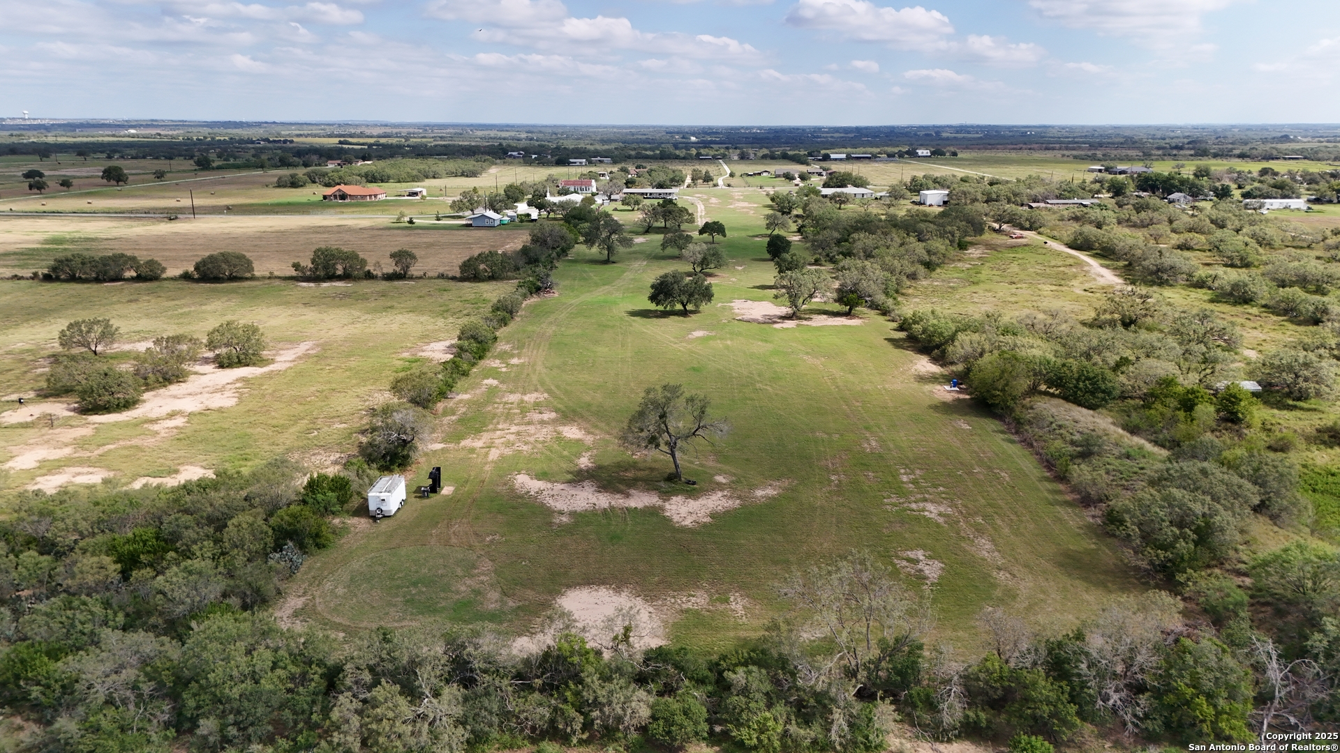 14646 East Lupon Road St. Hedwig, TX 78152 - Photo 1 of 6 a view of a lake with outdoor space