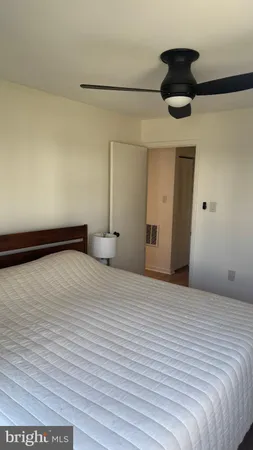 a large white bed in a white room