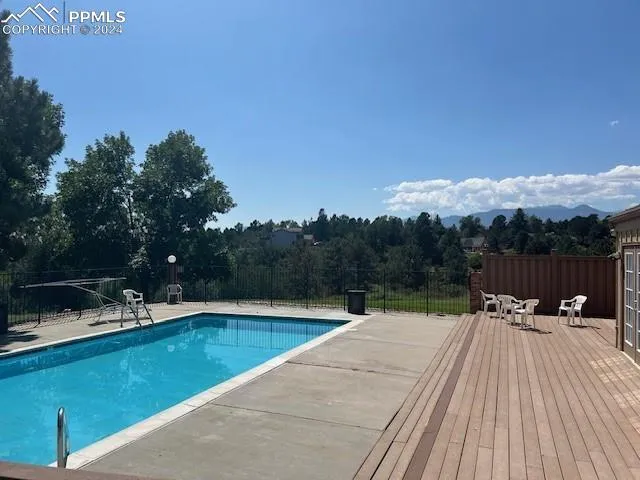 a view of a swimming pool with a lounge chair