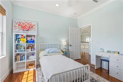a bedroom with a bed and a book shelf
