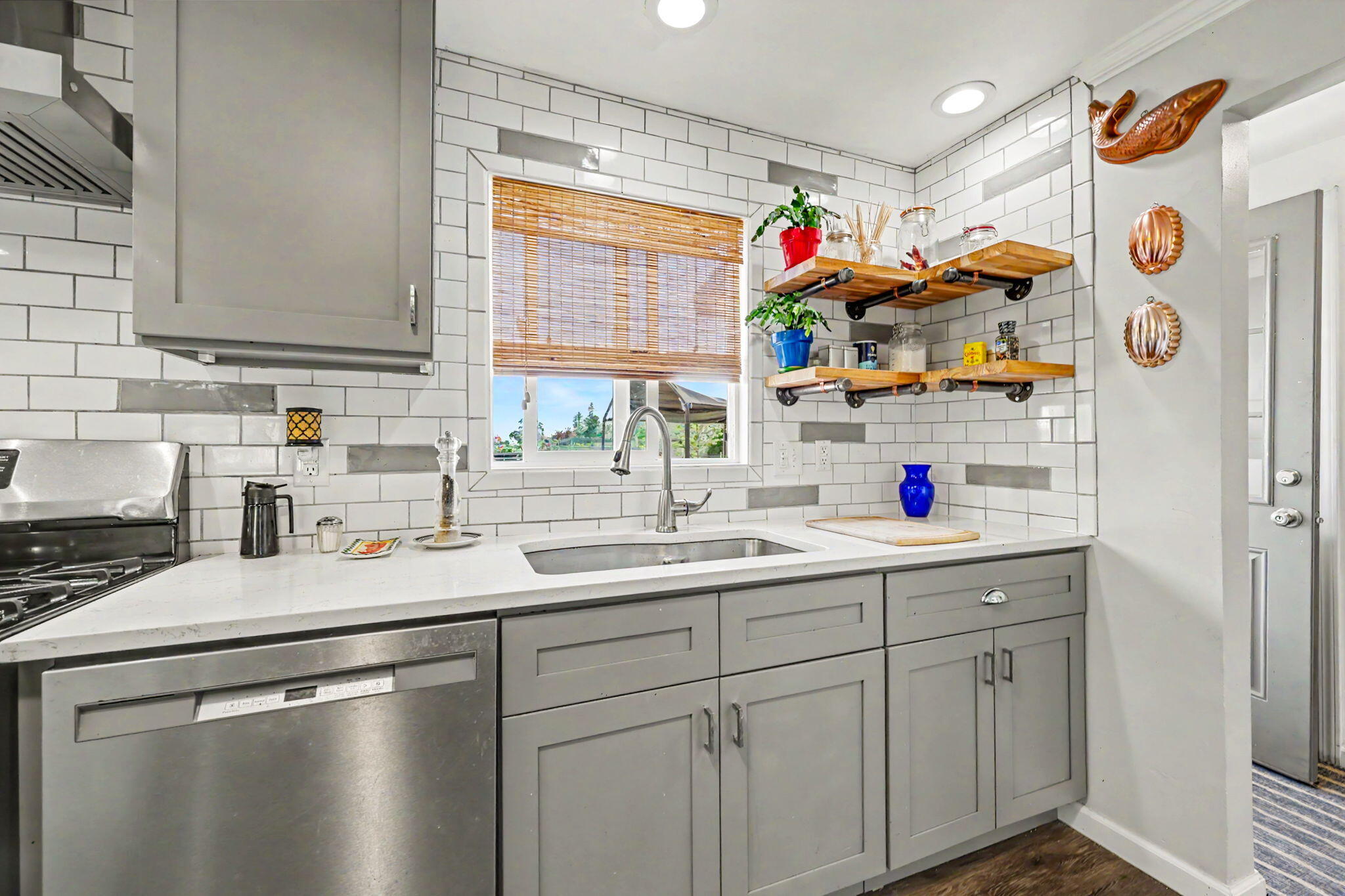 145 Highway 234 Eagle Point, OR 97524 - Photo 12 of 43 a kitchen with white cabinets and white appliances