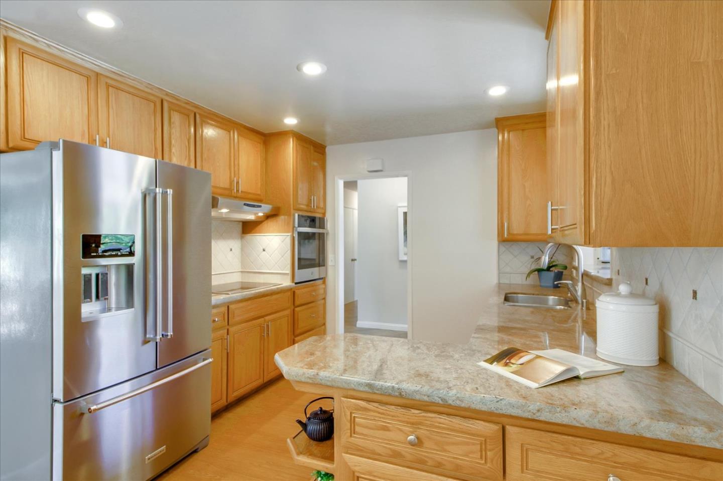 2891 Benjamin Avenue San Jose, CA 95124 - Photo 11 of 31 a kitchen with refrigerator and cabinets