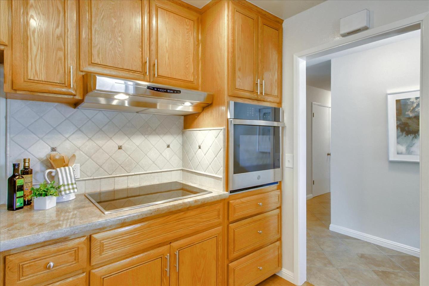 2891 Benjamin Avenue San Jose, CA 95124 - Photo 12 of 31 a kitchen with stainless steel appliances a refrigerator and cabinets