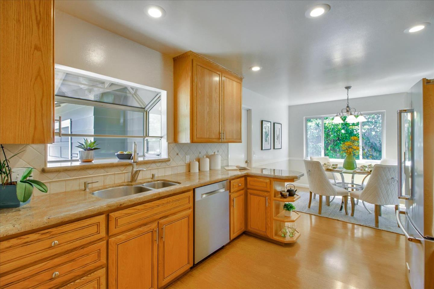 2891 Benjamin Avenue San Jose, CA 95124 - Photo 13 of 31 a kitchen with lots of counter top space and dining table