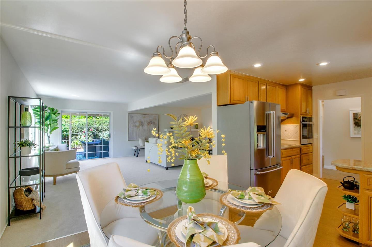 2891 Benjamin Avenue San Jose, CA 95124 - Photo 16 of 31 a view of a dining room with furniture a chandelier and large windows