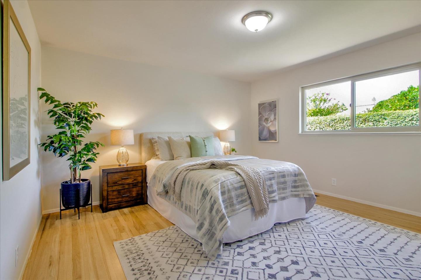 2891 Benjamin Avenue San Jose, CA 95124 - Photo 20 of 31 a bedroom with a bed and a potted plant