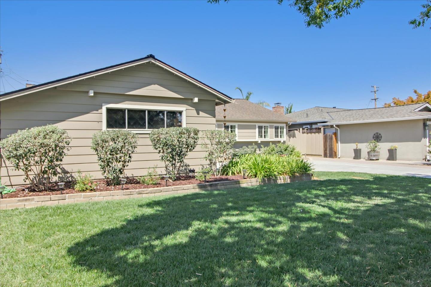 2891 Benjamin Avenue San Jose, CA 95124 - Photo 2 of 31 a front view of a house with a yard